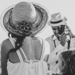A black and white family portrait of a couple and child overlooking Sorocaba, Brazil on a sunny day.
